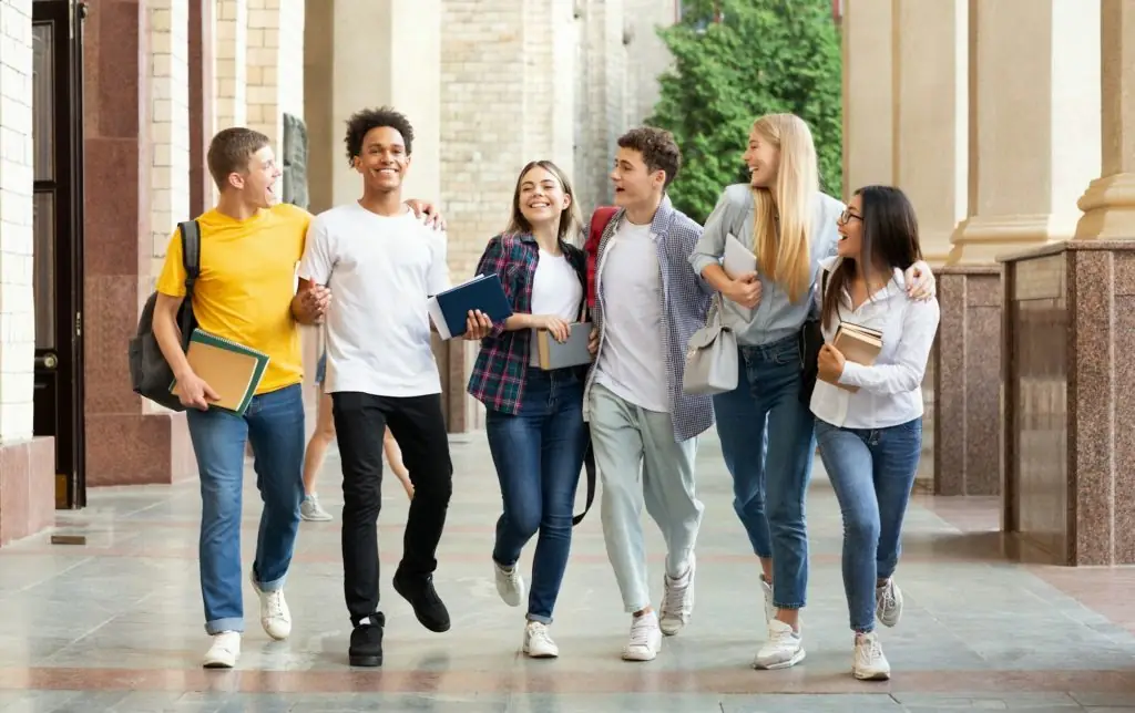 Successful tests. Students walking in university campus
